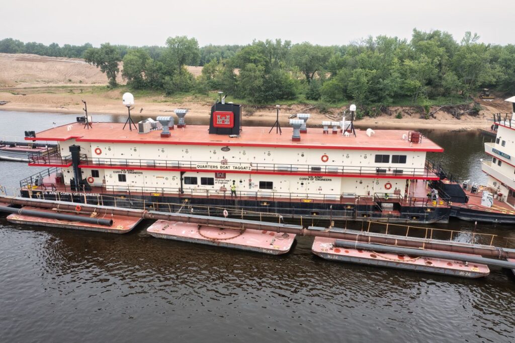 Local Scrap Metal Prices: Barge Scrap Insights Scrap barge berthed waiting for local scrap metal prices negotiation between the buyer and the owner.